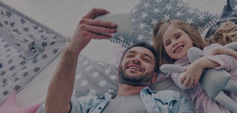 Happy father and daughter smiling for a picture