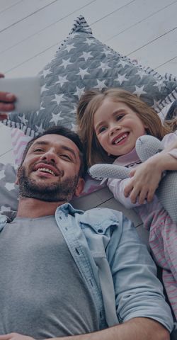 Happy father and daughter smiling for a picture